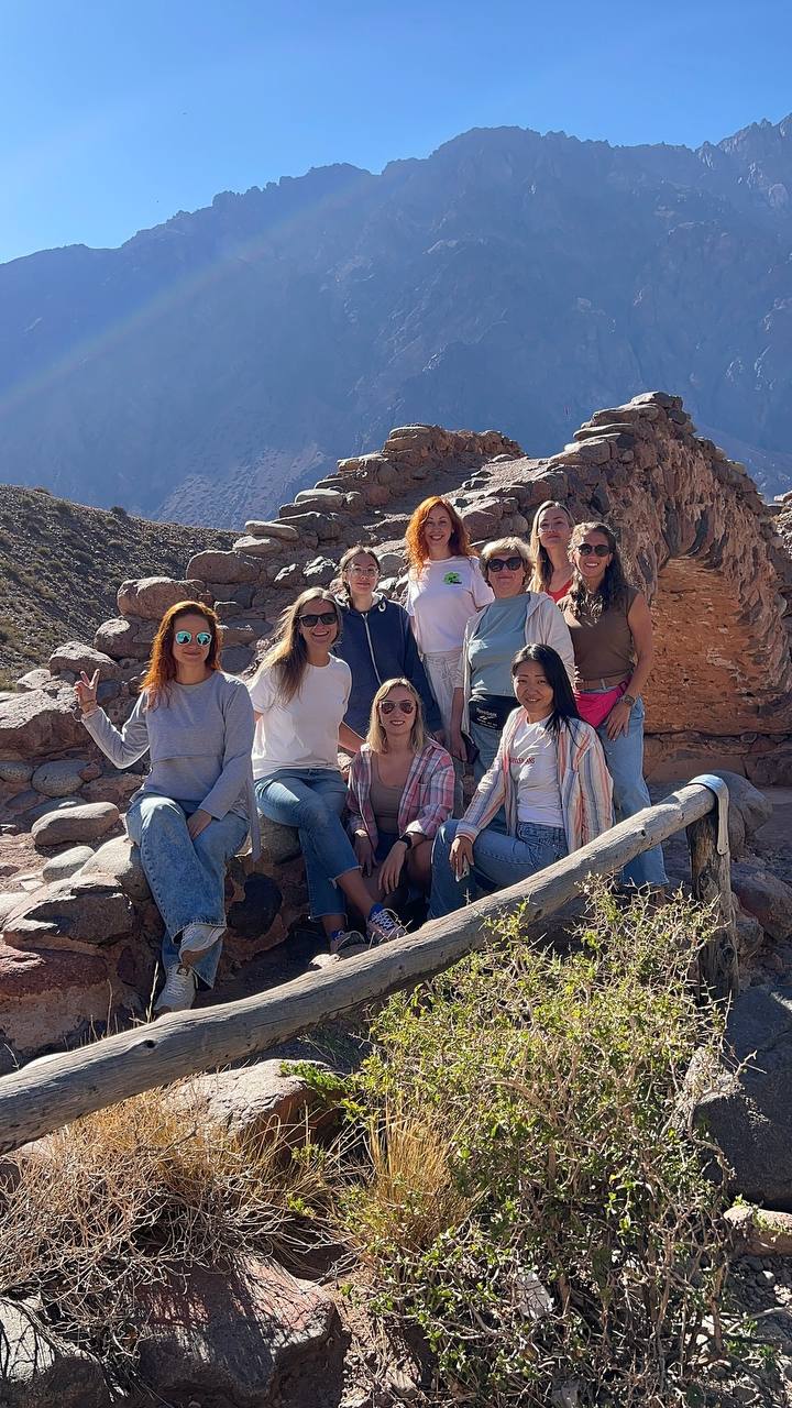 The group at ancient stone ruins in the mountains
