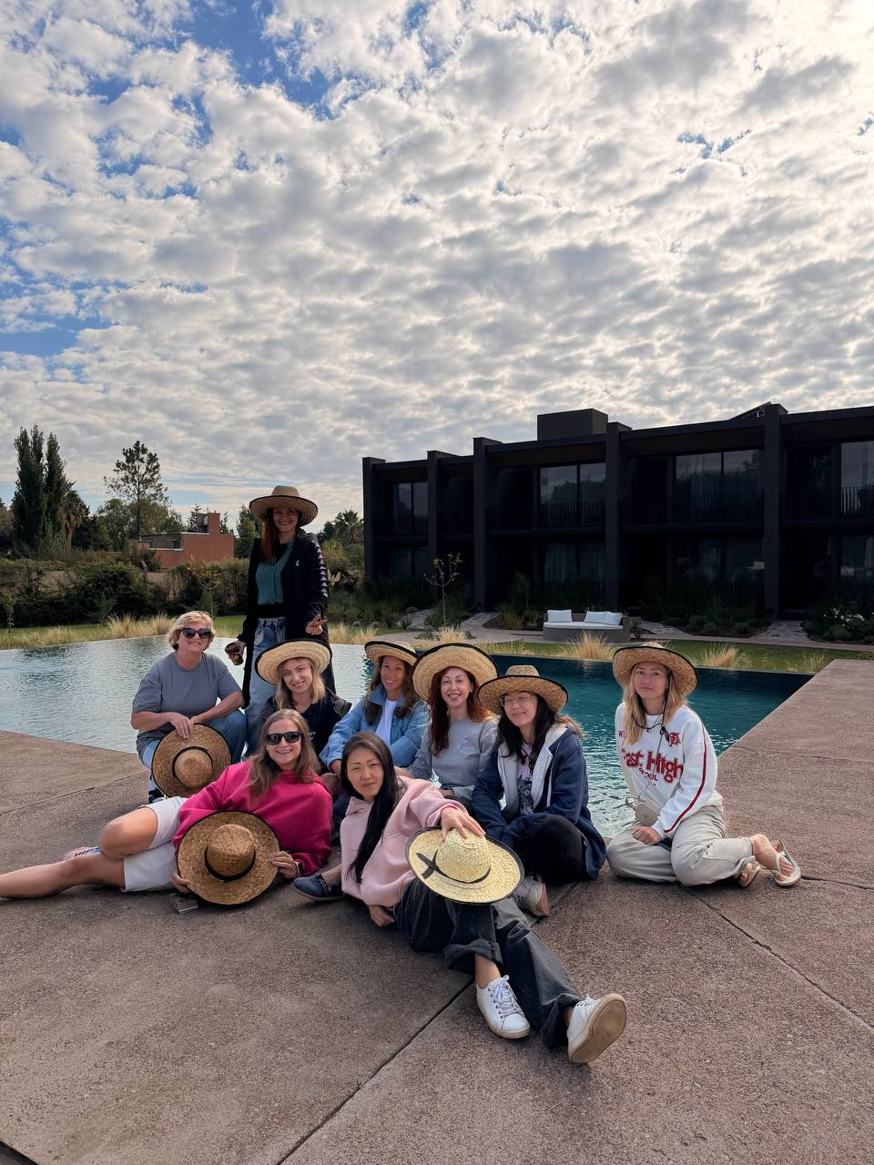 Poolside afternoon with straw hats in Mendoza