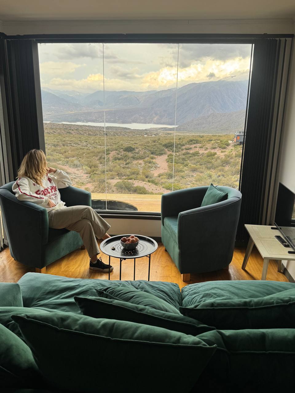 Lodge interior with panoramic Andes window
